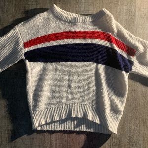 White pull over with red, blue and white stripe